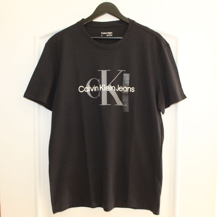 Calvin Klein Logo T-Shirt, Black, Crew Neck, Short-Sleeves, Calvin Klein Logo Across Chest, Size Men’s L (Large), Nwt (New With Tags), Never Worn Or Used. Calvin Klein Relaxed Fit Crew Neck T-shirt, Calvin Klein Graphic Tee With Crew Neck, Calvin Klein Graphic Tee Crew Neck, Calvin Klein Relaxed Fit Casual T-shirt, Calvin Klein Graphic Tee Short Sleeve T-shirt, Calvin Klein Logo Cotton Tops, Calvin Klein Cotton Tops With Logo, Calvin Klein Cotton Logo Tops, Calvin Klein Graphic Tee Short Sleeve