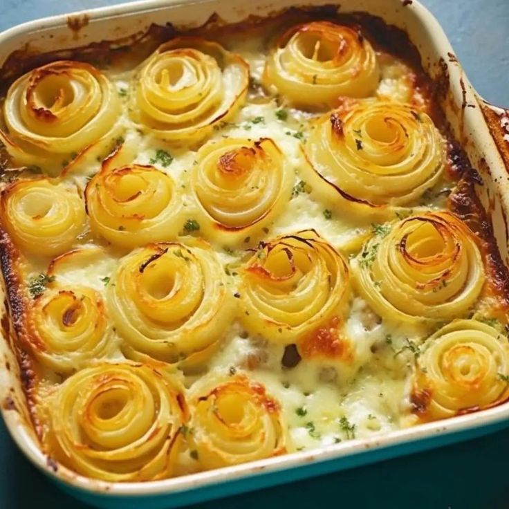 a casserole dish with cheese and onions in it