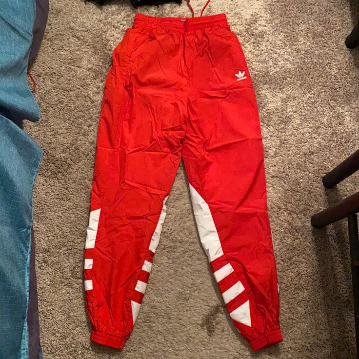 Windbreak Type Of Pants. Part Of A Jumpsuit Set. Brand New. Barely Worn Red Sporty Trousers, Sporty Red Pants For Spring, Red Sporty Sweatpants For Spring, Sporty Red Sweatpants For Spring, Red Sweatpants With Elastic Waistband For Spring, Sporty Red Summer Pants, Red Stretch Sweatpants For Spring, Red Sweatpants With Pockets For Spring, Jumpsuit Pants