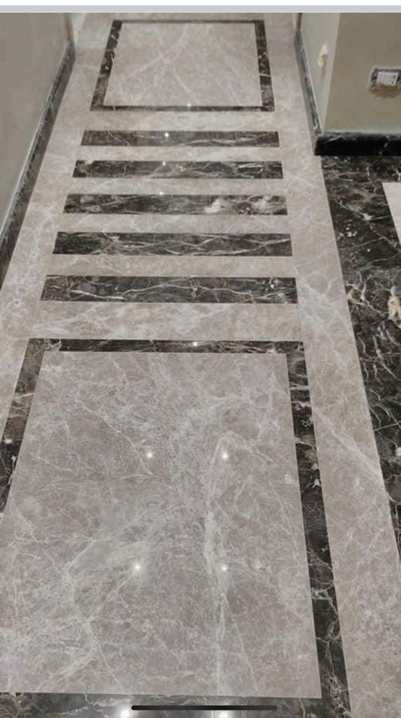 a marble floor with black and white lines on it