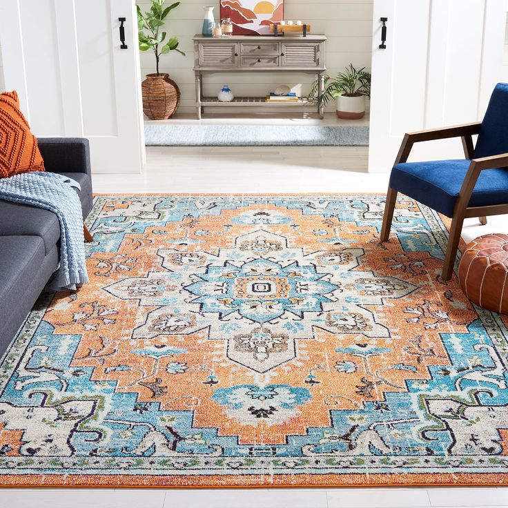 an orange and blue rug in a living room