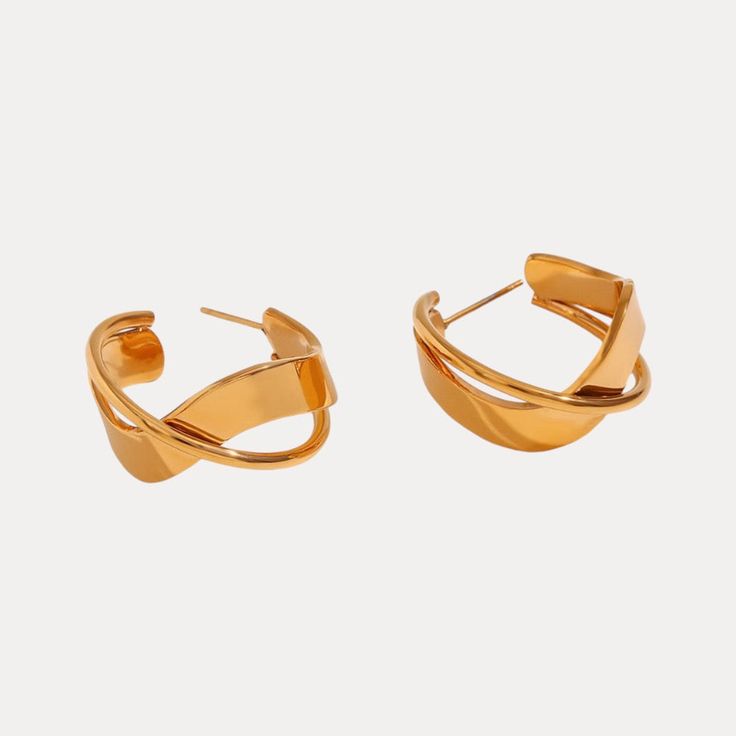 Discover the beauty of our Overlapping Hoops! With a unique artistic design, these hoops are not just trendy and fashionable, but also hypoallergenic and water-resistant. Elevate your style and feel confident wearing these stunning earrings. Material: Stainless Steel (Gold-Plated) Inner diameter: 22 mm Outer diameter: 30 mm Thickness: 14 mm Post Length: 12 mm Weight: 7 g Crystal Ear Cuff, Vacation Style, Everyday Earrings, Stunning Earrings, Wedding Night, Pearl Studs, Wedding Looks, Feel Confident, Artistic Designs