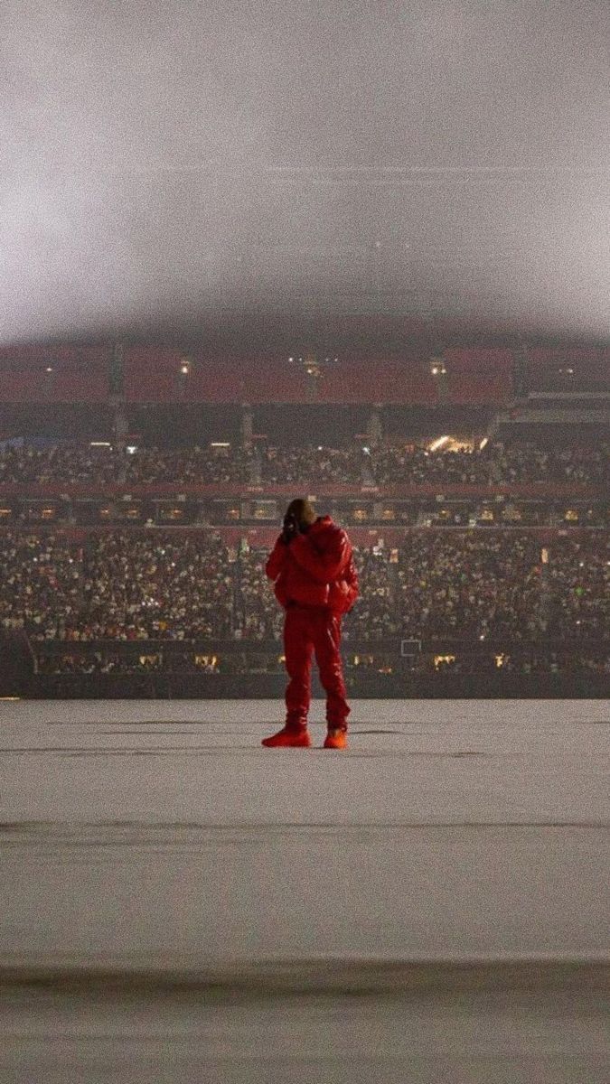 a person in red is standing on a stage