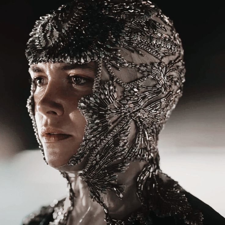 a woman with black hair wearing a headdress in the movie star trek into space