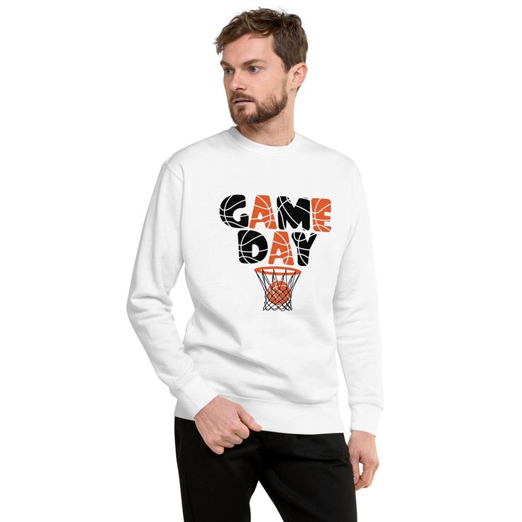 Get ready to dominate the court and show off your team spirit with this vibrant "Game Day" sweatshirt! This bold and energetic design features the phrase "GAME DAY" in dynamic black and orange letters with basketball-inspired patterns. Completing the look is a basketball perfectly sinking into the net, symbolizing the thrill of the game. This product is made especially for you as soon as you place an order, which is why it takes us a bit longer to deliver it to you. Making products on demand instead of in bulk helps reduce overproduction, so thank you for making thoughtful purchasing decisions! Game Day Sweatshirt, Basketball Game, A Basketball, Basketball Games, Black And Orange, The Net, The Court, Team Spirit, Game Day