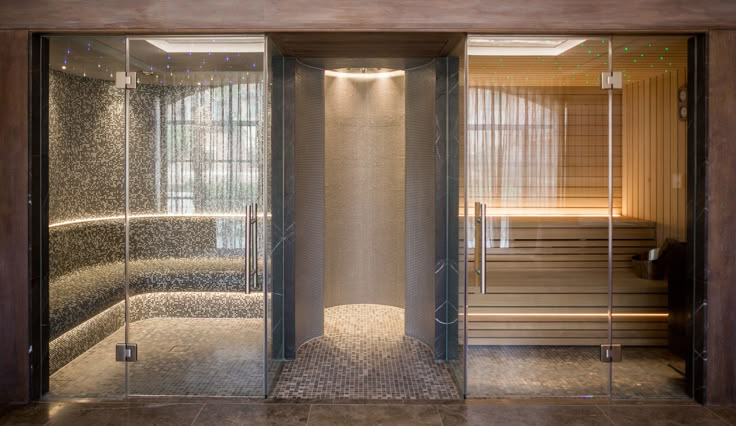 the inside of a sauna with glass doors