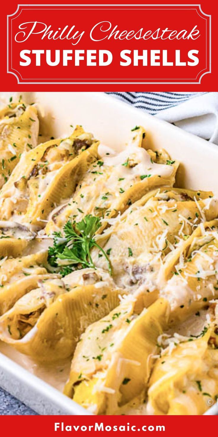 a casserole dish filled with shells covered in cheese and parmesan sauce