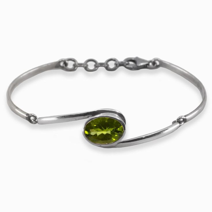 Peridot Bangle Bracelet Modern Peridot Jewelry For Formal Occasions, Silver Faceted Peridot Jewelry, Elegant Silver Peridot Bracelets, Green Sterling Silver Bangle Bracelet, Modern Faceted Bracelet Jewelry, Modern Faceted Jewelry Bracelet, Silver Peridot Gemstone Bracelets, Silver Bracelets With Peridot Gemstone, Sterling Silver Faceted Bracelets