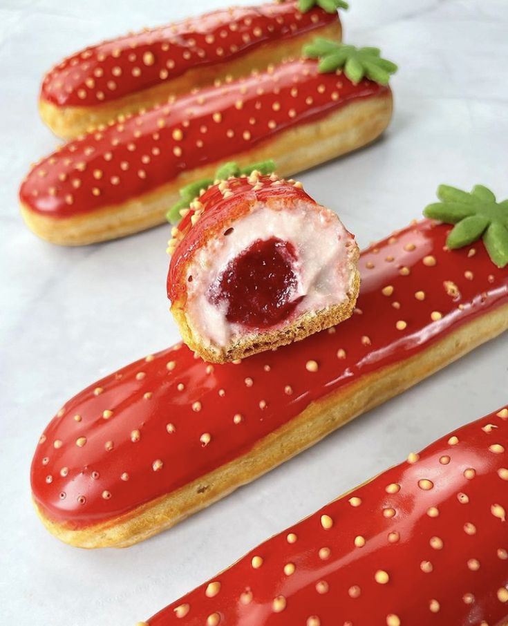 strawberry shortbreads with jelly filling and sprinkles on them are ready to be eaten