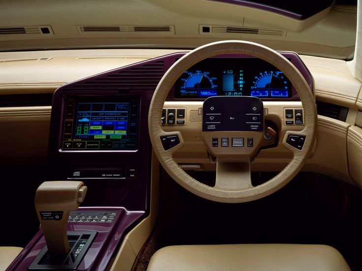 the interior of a luxury car with dashboard and electronic devices on it's display screen