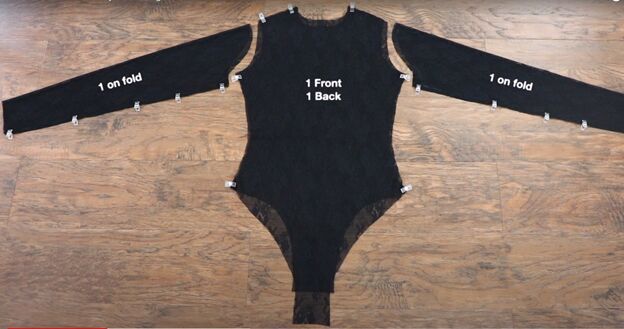 the bodysuit is cut out and labeled with measurements