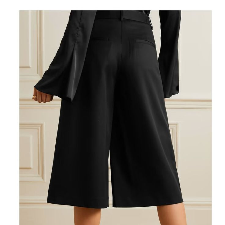 Smart, Practical Piece That You'll Get Plenty Of Wear Out Of. Burberry Ladies Silk Wool Tailored Culottes. Crafted In A Lightweight Blend Of Silk And Wool, These Wide-Leg High-Rise Waist Culottes Feature Hook-And-Bar And Zip Fly Closure, Side Slip Pockets And Back Button-Through Welt Pockets. Fitted Knee-length Pants For Work, Black Ankle-length Culottes For Work, Chic Fitted Culottes For Work, Chic Fitted Culottes For Office, Elegant Black Knee-length Bottoms, Workwear Black Culottes With Pockets, Black Culottes With Pockets For Workwear, Tailored Knee-length Formal Bottoms, Fitted Wide Leg Culottes For Work