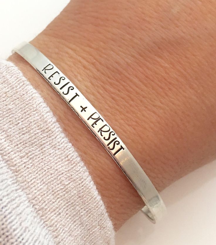 "Resist Bracelet - sterling silver cuff bracelet - political jewelry One 1/8\" x 6\" sterling silver cuff bracelet made from 18 gauge sterling sheet. It is hammered, and then stamped with the words Resist and Persist As with all hand stamped jewelry, each piece is made just for you, so there may be slight differences. This is not to be seen as a defect, but as part of the character of the piece. Thank you for your understanding. Production time may vary as each one is made to order. Please see m Hand Stamped Jewelry, Sterling Silver Cuff Bracelet, Bracelet Sterling Silver, Stamped Jewelry, Sterling Silver Cuff, Cartier Love Bracelet, Silver Cuff Bracelet, Silver Cuff, Bracelet Stack