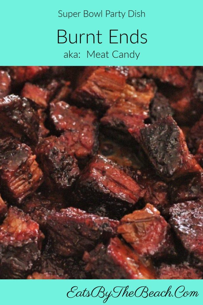 some food that is sitting on top of a blue plate with the words, super bowl party dish burnt ends aka meat candy