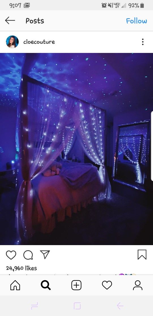 an instagram photo of someones bedroom with blue lights on the ceiling and bed