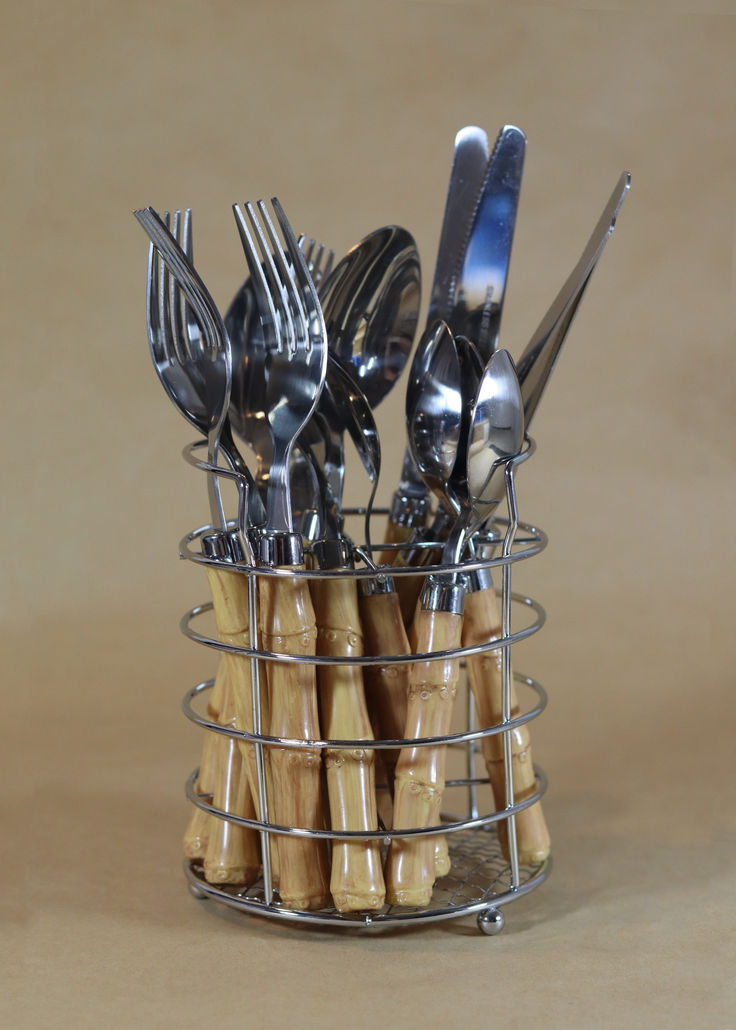 silverware and utensils are in a wire basket