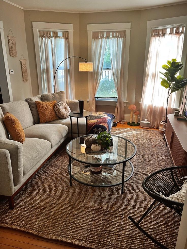 a living room with two couches and a coffee table in the middle of it