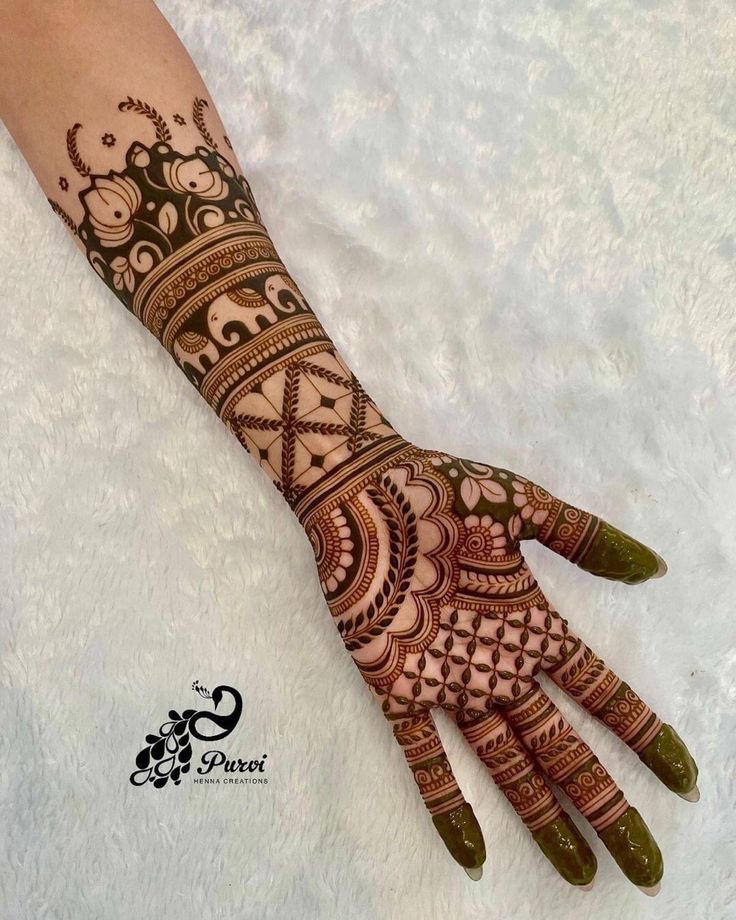 henna tattoo on the palm of someone's hand