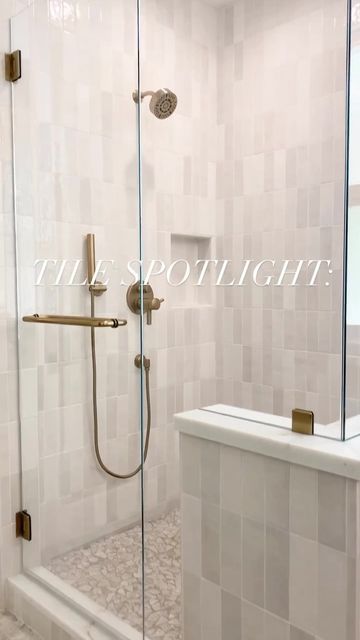 a walk in shower sitting next to a bath tub