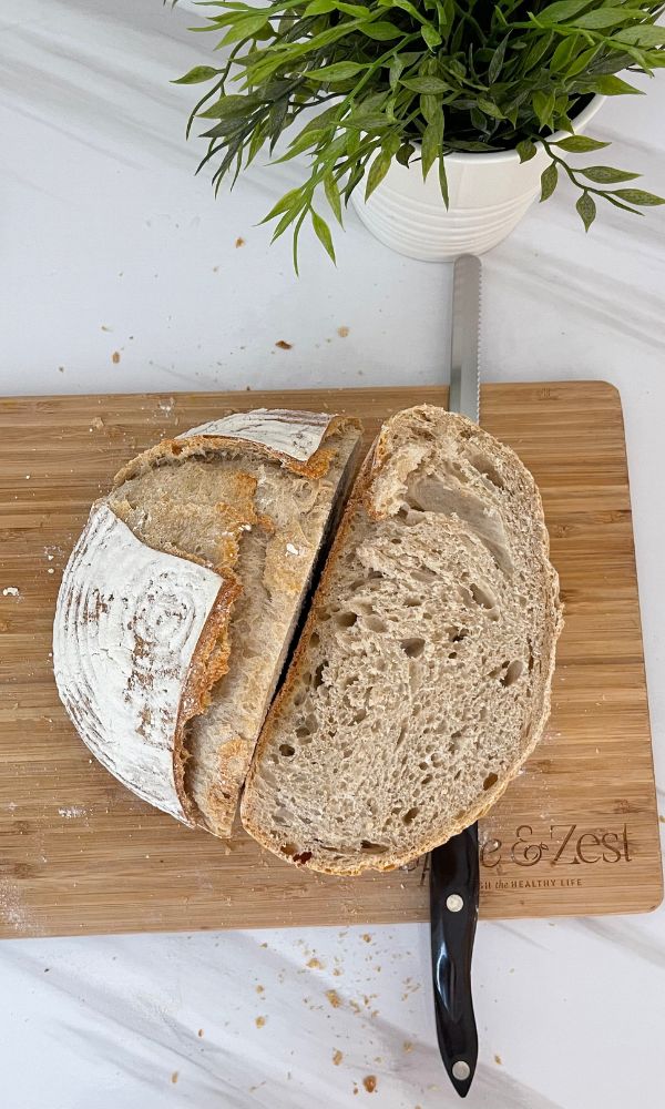 a loaf of bread sitting on top of a cutting board