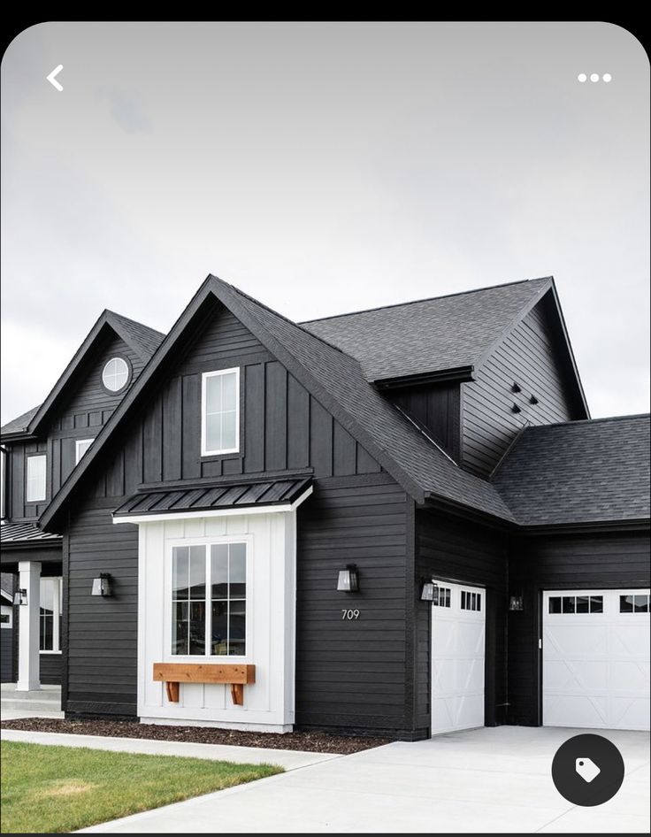 a black house with white trim and windows