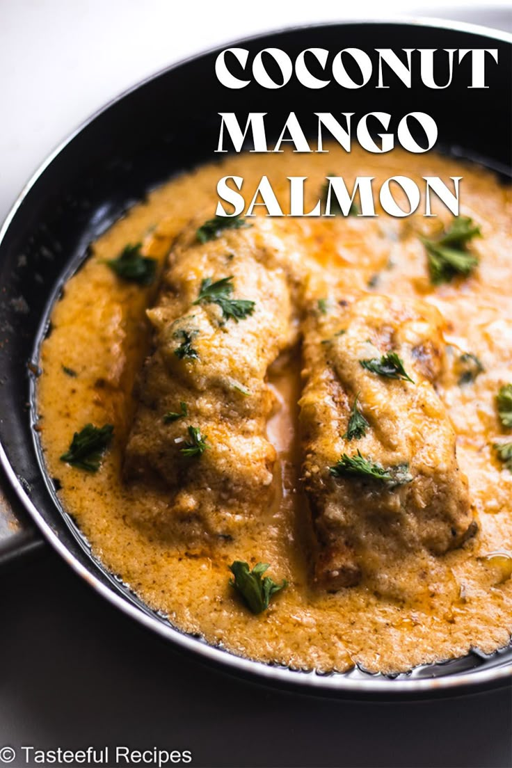 Close up image of salmon in a skillet covered in a coconut mango sauce topped with fresh parsley. Mango Coconut Sauce, Salmon Mango Recipes, Mango Salmon Recipes, Mango Fish Recipes, Mango Sauce For Salmon, Coconut Salmon, Salmon With Mango Sauce, Salmon Recipes Coconut Milk, Creamy Coconut Salmon