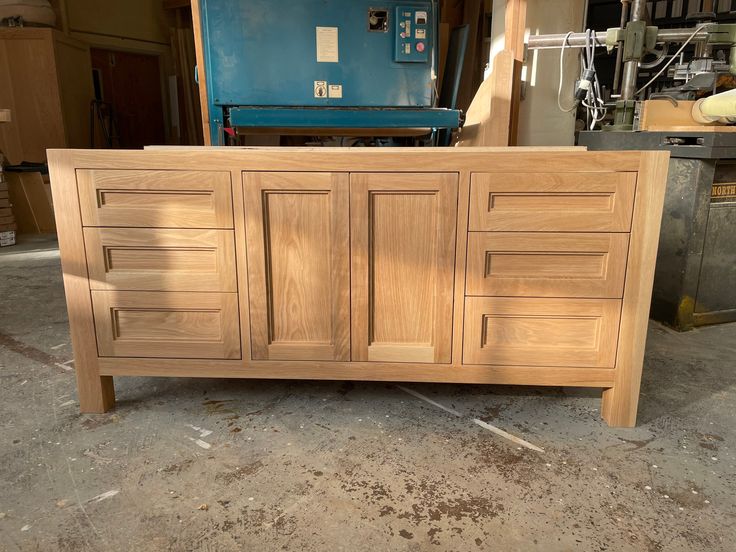 a large wooden cabinet sitting inside of a building