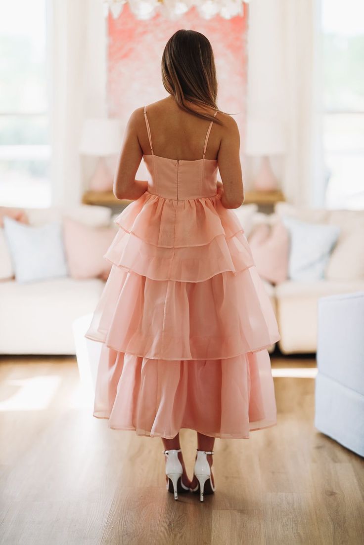 This ruffle layered midi dress is stunning! We love the boning in the top that makes it so flattering. Fit: True to size, model is 5'6 wearing size small Blush Midi Dress, Ruffles Bridesmaid Dresses, Make Me Blush, Pink Bridesmaid Dress, Pink Ruffle, Blush Pink, The Top, Bridesmaid Dresses, Blush