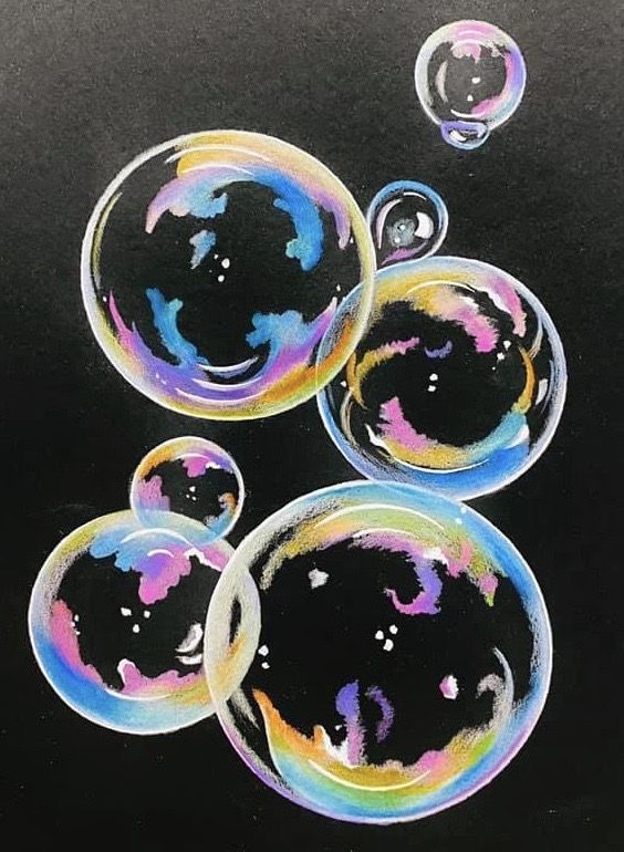 three soap bubbles floating on top of each other