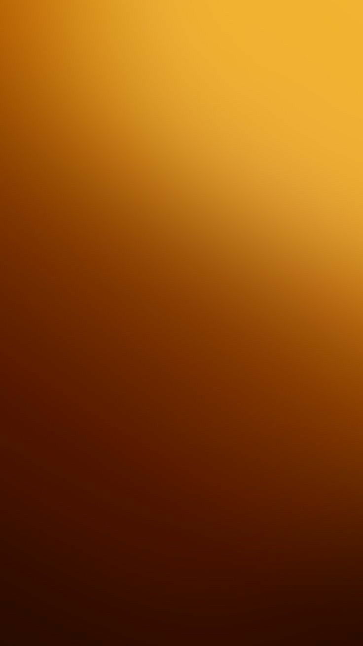 an orange and yellow blurry background with the light on it's left side