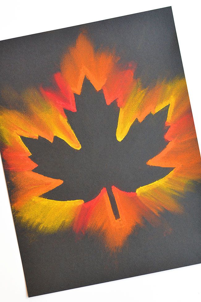 a painting of a maple leaf with orange, yellow and red colors