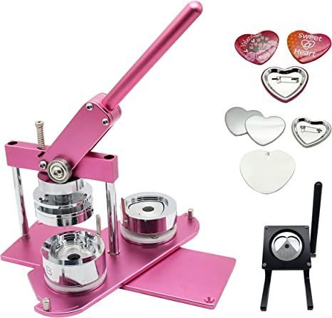 the pink machine is next to some heart shaped buttons and cutters on a white background