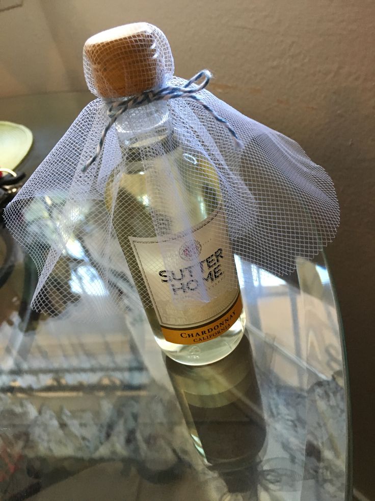 a bottle of alcohol sitting on top of a glass table