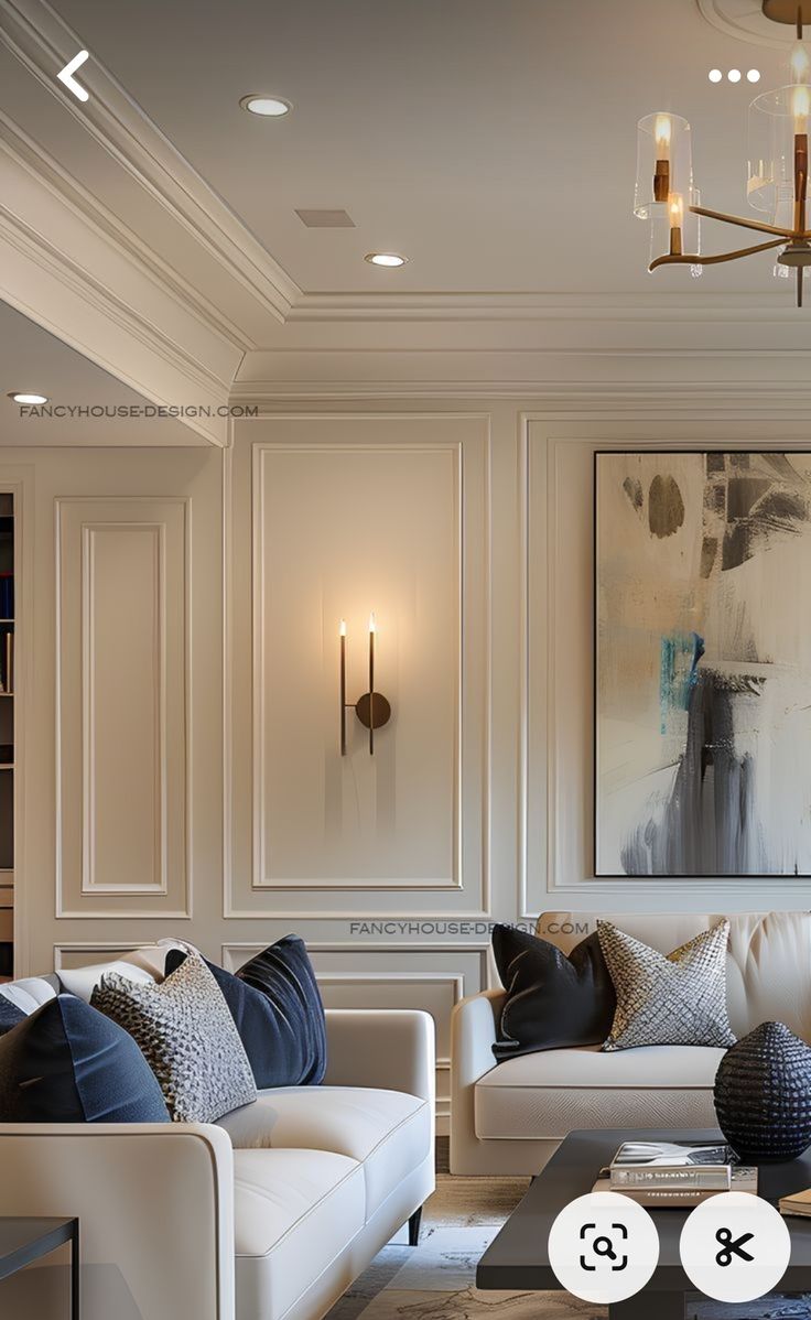 a living room filled with furniture and a chandelier