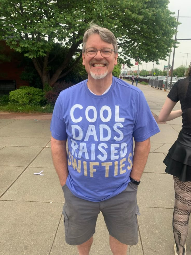 an older man wearing a t - shirt that says cool dads raised nifties