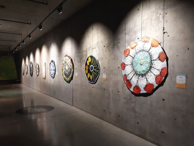 there are many circular artwork on the wall