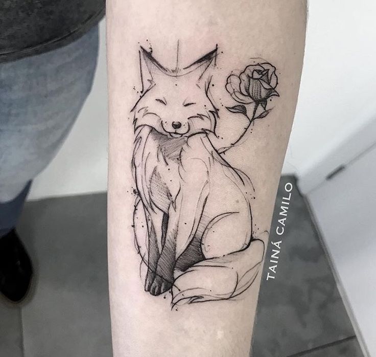 a black and white tattoo of a fox holding a rose