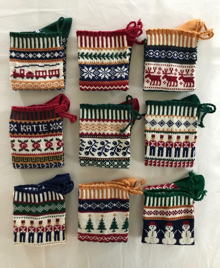 nine knitted bags with different designs on them