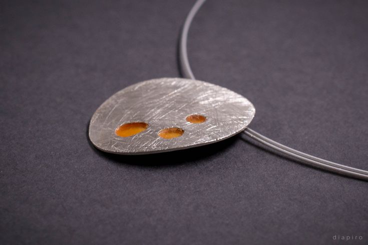 Brushed silver Necklace with orange enamel. This oval shape necklace is made of fine sterling silver 925 and torch enameled. The pendant measures 2cm in width and 2.6 cm in height. The chain is stainless steel wire covered with plastic and measures 42 cm in length. MATCHING EARRINGS: https://www.etsy.com/listing/963650939/orange-stud-earrings-brushed-silver-925?ref=shop_home_active_2&frs=1 MATCHING RING: https://www.etsy.com/listing/969319723/orange-enamel-silver-ring-statement-ring?ref=shop Modern Orange Necklace As Gift, Modern Orange Necklace For Gift, Modern Orange Metal Jewelry, Modern Orange Sterling Silver Jewelry, Modern Orange Oval Jewelry, Handmade Silver Enamel Necklace, Orange Oval Sterling Silver Necklace, Orange Oval Sterling Silver Jewelry, Modern Silver Enamel Necklace