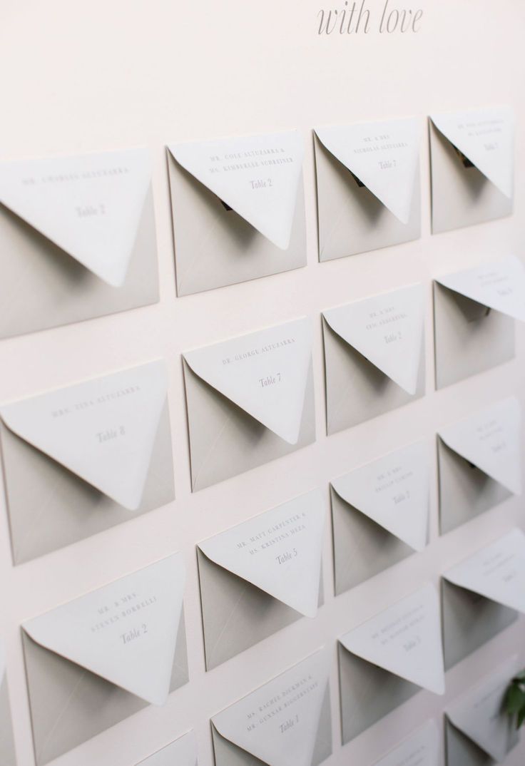 there are many folded cards on the wall