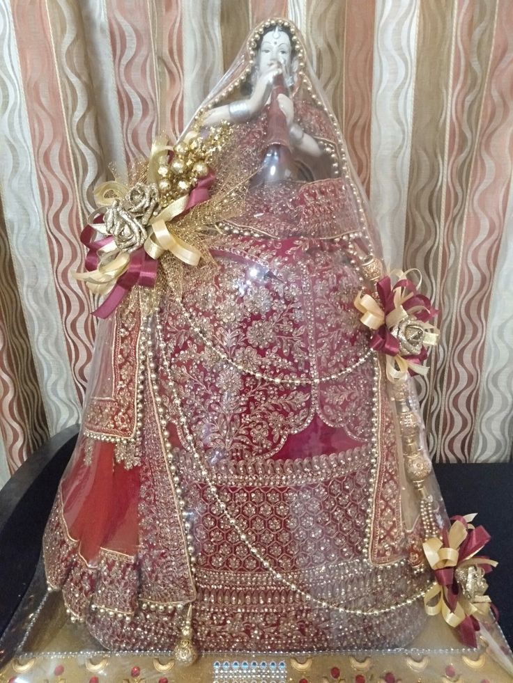 a red and gold wedding dress on display