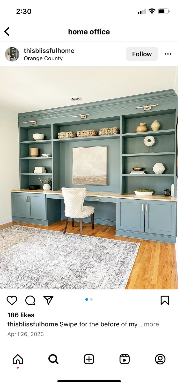 an image of a living room with blue cabinets and white furniture on the wall, in front of a gray area rug