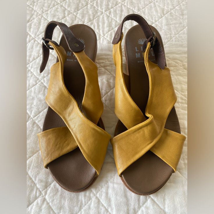 Lili Mill Italian Leather Shoes. Super Soft Leather In A Golden Mustard Color. Excellent Unused Condition. Size Euro 38. Handcrafted In Italy. Yellow Sandals With Heel Strap And Round Toe, Yellow Leather Heels With Cushioned Footbed, Yellow Closed Toe Sandals Medium Width, Yellow Closed Toe Sandals With Heel Strap, Yellow Leather Wedge Heel Sandals, Yellow Leather Heels With Leather Sole, Yellow Wedge Heel Sandals With Heel Strap, Yellow Wedge Heels With Heel Strap, Yellow Leather Flat Heel Sandals