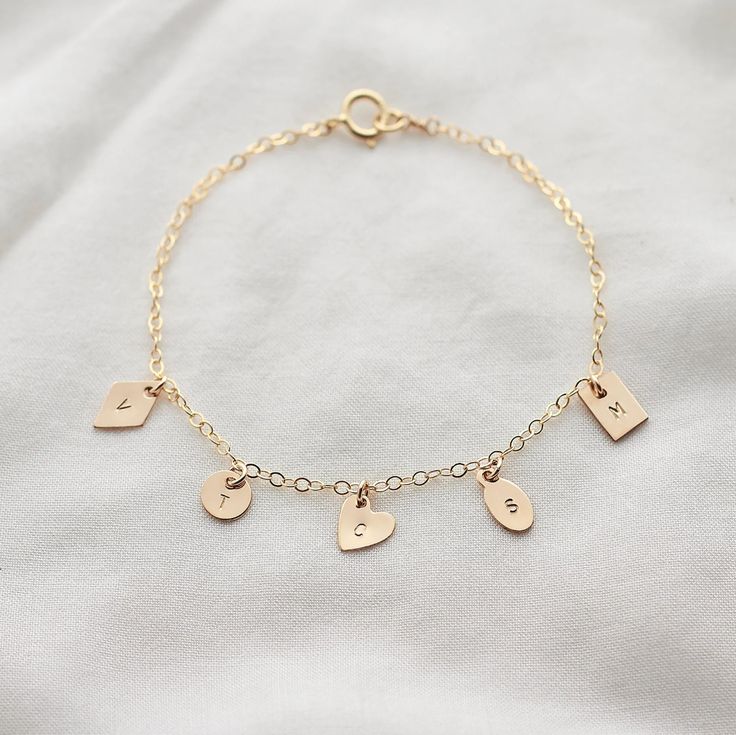 Family Initials Charm Bracelet 14k Gold Filled Sterling | Etsy Sterling Silver Name Bracelet With Heart Charm For Gift, Personalized Minimalist Sterling Silver Charms, Minimalist Personalized Sterling Silver Charms, Dainty Gold Name Bracelet With Heart Charm, Dainty Sterling Silver Charm Bracelet With Heart Charm, Dainty 14k Gold Hypoallergenic Name Bracelet, Dainty 14k Gold Name Bracelet, Personalized 14k Gold Charm Bracelet Gift, Personalized Dainty Initial Pendant Charms