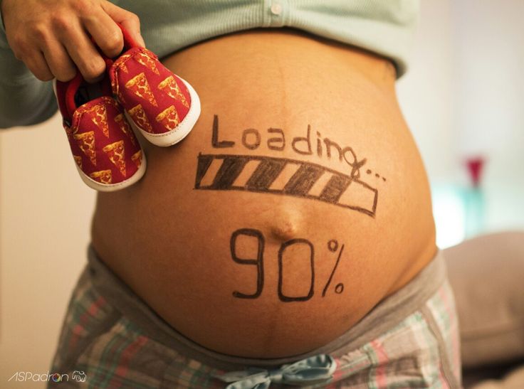 a pregnant belly with the words laundry written on it