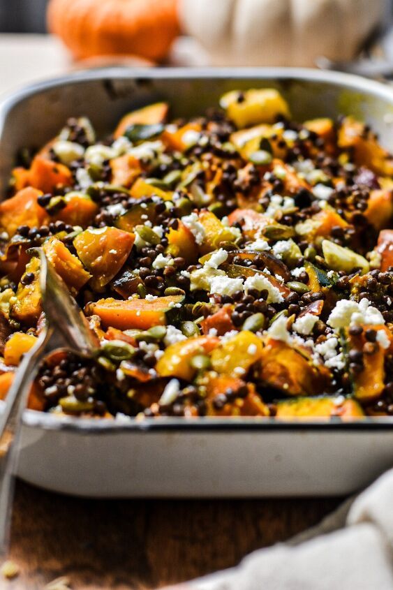 a casserole dish with carrots, black beans and feta cheese