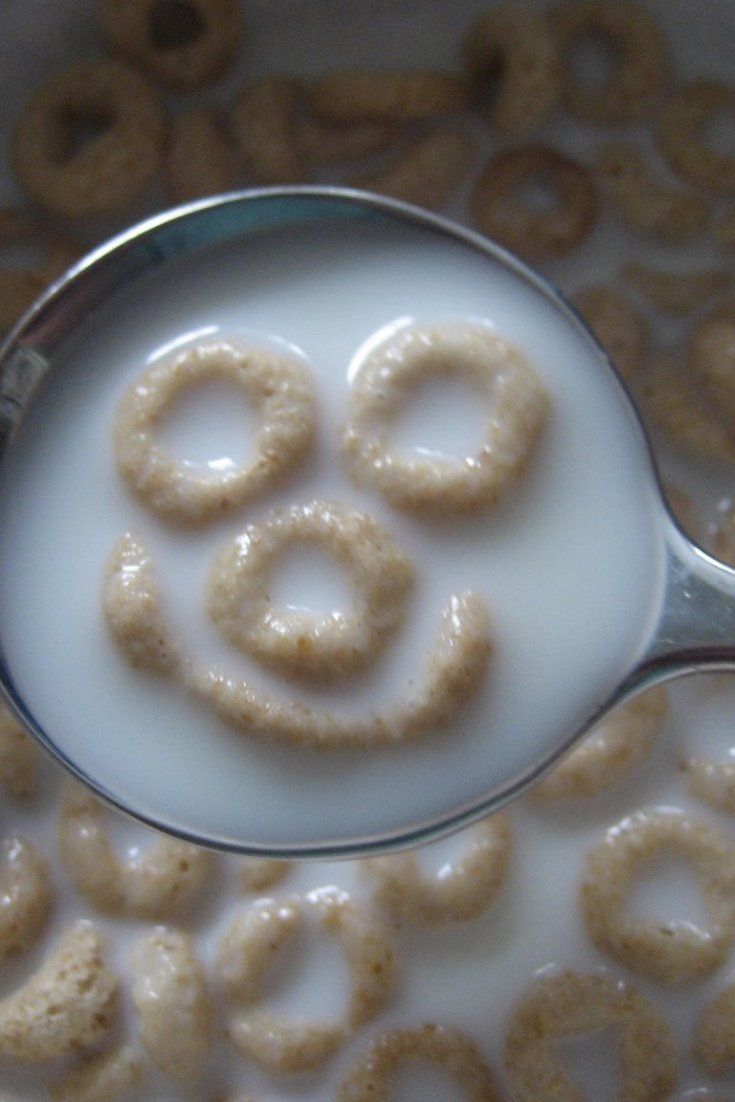 a spoon with some cereal in it