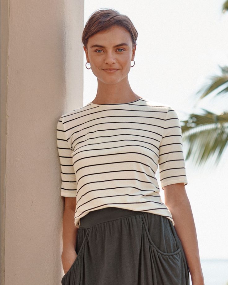 Our essential women's tee shirt is streamlined with a modern length and slimmer, elbow-length sleeves. Seasonless in Peruvian organic pima cotton and TENCEL Lyocell with a touch of shape-retaining spandex. Classic fit. Scoop neckline. Elbow-length slim sleeves. High-hip length. Organic pima cotton/TENCEL Lyocell/spandex. Women's essential elbow sleeve tee shirt by Garnet Hill. Black And White Tees, Preppy Dresses, Garnet Hill, Women Essentials, Modest Fashion Outfits, Work Looks, Elbow Sleeve, Tees For Women, Elbow Length Sleeve