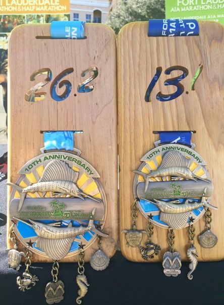 two wooden boards with medals attached to them