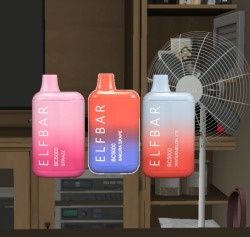 three water bottles sitting on top of a table next to a fan and bookshelf